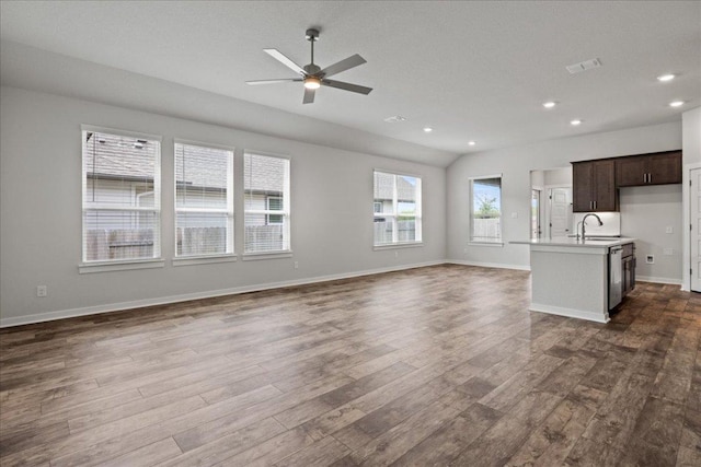 240 Camino Verde Dr, San Marcos, TX 78666 - unfurnished living room featuring dark wood-style flooring, ceiling fan, and recessed lighting