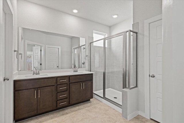 240 Camino Verde Dr, San Marcos, TX 78666 - full bath with a shower stall, double vanity, and tile patterned floors