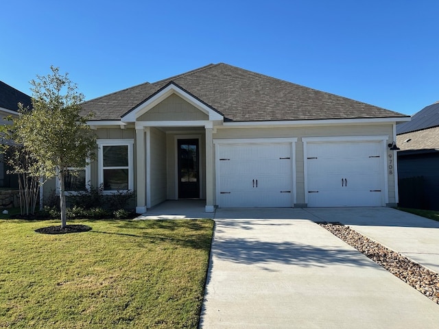 9708 Gladsome Path, Manor, TX 78653 - single story home with roof with shingles, concrete driveway, a front lawn, and an attached garage