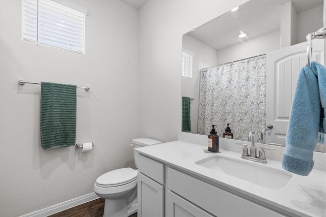 110 Saide St, Georgetown, TX 78626 - bathroom with vanity, toilet, wood finished floors, baseboards, and a shower with curtain