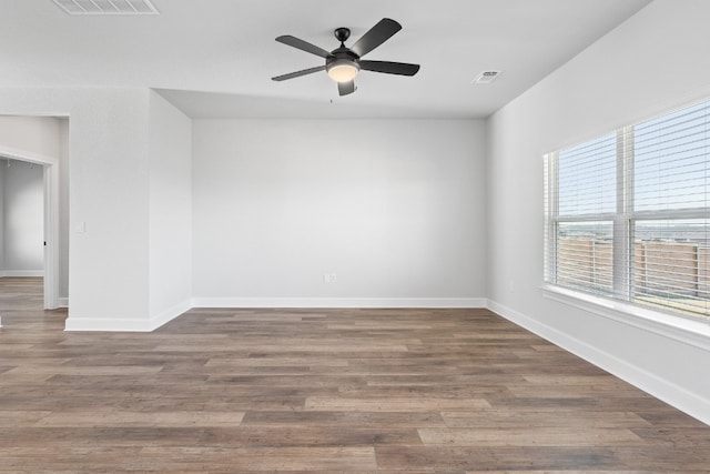 17012 Wind Chime Dr, Manor, TX 78653 - empty room featuring a ceiling fan, baseboards, and wood finished floors