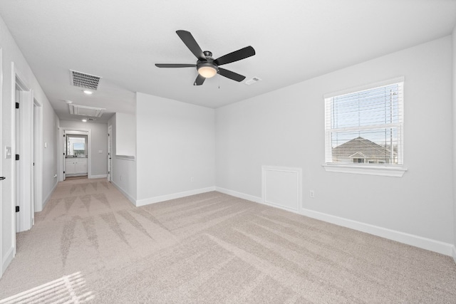 17012 Wind Chime Dr, Manor, TX 78653 - unfurnished room with attic access, light carpet, baseboards, and a ceiling fan