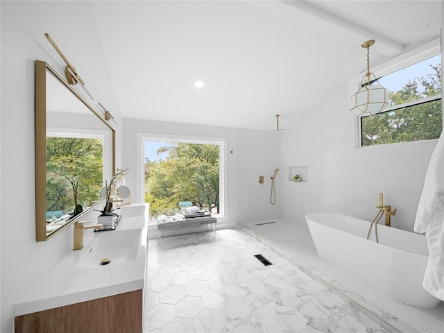 2004 N Cuernavaca Dr, Austin, TX 78733 - bathroom with a freestanding tub, double vanity, marble finish floors, plenty of natural light, and recessed lighting