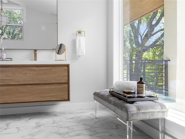 2004 N Cuernavaca Dr, Austin, TX 78733 - bathroom featuring marble look tiles and baseboards