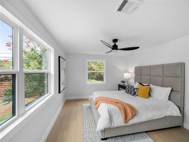 2004 N Cuernavaca Dr, Austin, TX 78733 - bedroom featuring light wood-style flooring, baseboards, and a ceiling fan