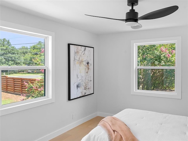 2004 N Cuernavaca Dr, Austin, TX 78733 - bedroom featuring baseboards, light wood finished floors, and ceiling fan
