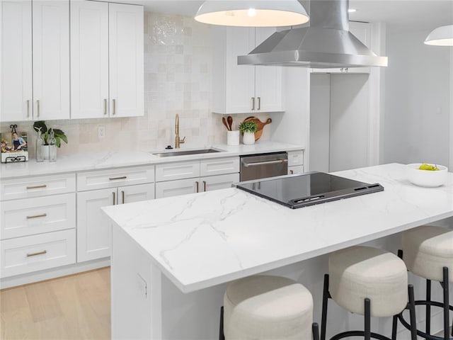 2004 N Cuernavaca Dr, Austin, TX 78733 - kitchen with wall chimney range hood, dishwasher, black electric stovetop, decorative backsplash, and a center island