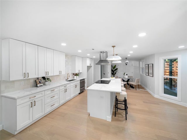 2004 N Cuernavaca Dr, Austin, TX 78733 - kitchen featuring range hood, light wood-style floors, recessed lighting, white cabinetry, and tasteful backsplash
