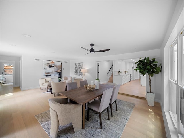 2004 N Cuernavaca Dr, Austin, TX 78733 - dining room with stairway, light wood-style floors, and a ceiling fan
