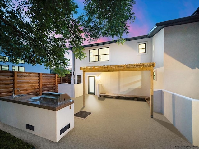 2004 N Cuernavaca Dr, Austin, TX 78733 - back of property with area for grilling and stucco siding