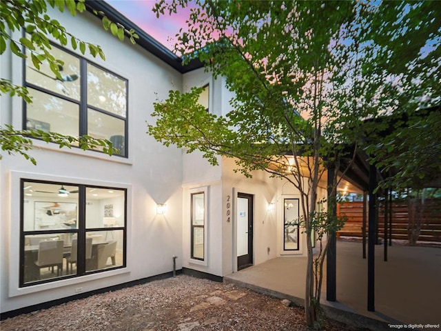 2004 N Cuernavaca Dr, Austin, TX 78733 - rear view of property featuring stucco siding and a patio area