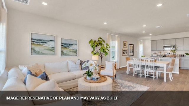 272 Morning Glory Loop, Kyle, TX 78640 - living room featuring light wood-style flooring, recessed lighting, and baseboards