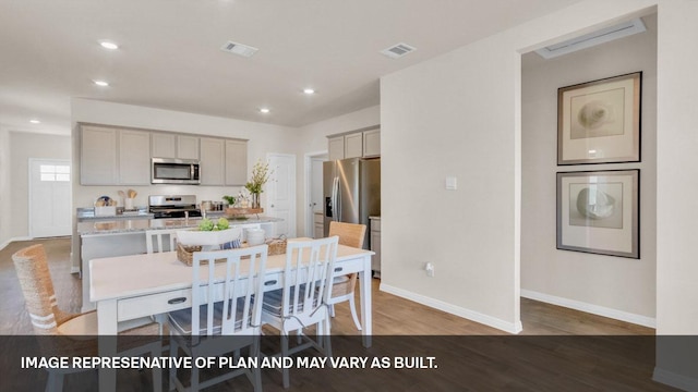 272 Morning Glory Loop, Kyle, TX 78640 - dining room featuring baseboards, wood finished floors, and recessed lighting