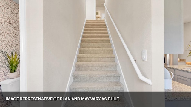 272 Morning Glory Loop, Kyle, TX 78640 - stairway featuring baseboards