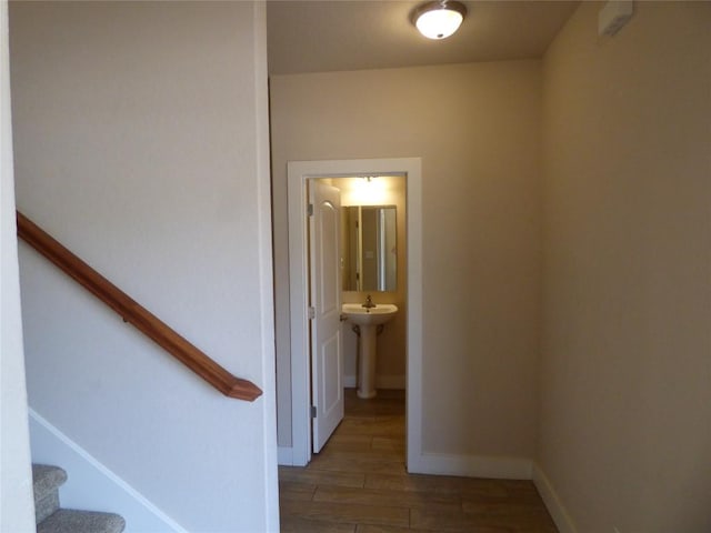 918 Crystal Brook Cv, New Braunfels, TX 78130 - hall with wood finished floors, stairs, a sink, and baseboards
