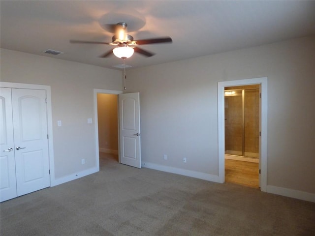 918 Crystal Brook Cv, New Braunfels, TX 78130 - unfurnished bedroom featuring carpet floors, baseboards, a closet, ensuite bathroom, and ceiling fan