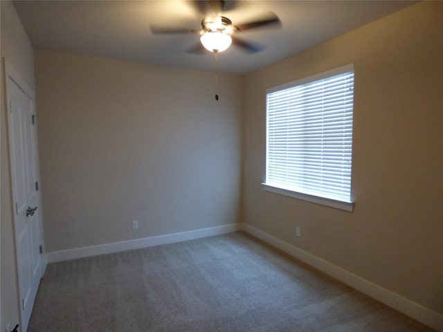 918 Crystal Brook Cv, New Braunfels, TX 78130 - spare room featuring a ceiling fan, light colored carpet, and baseboards