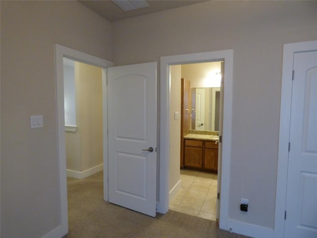 918 Crystal Brook Cv, New Braunfels, TX 78130 - unfurnished bedroom with baseboards, light carpet, and connected bathroom