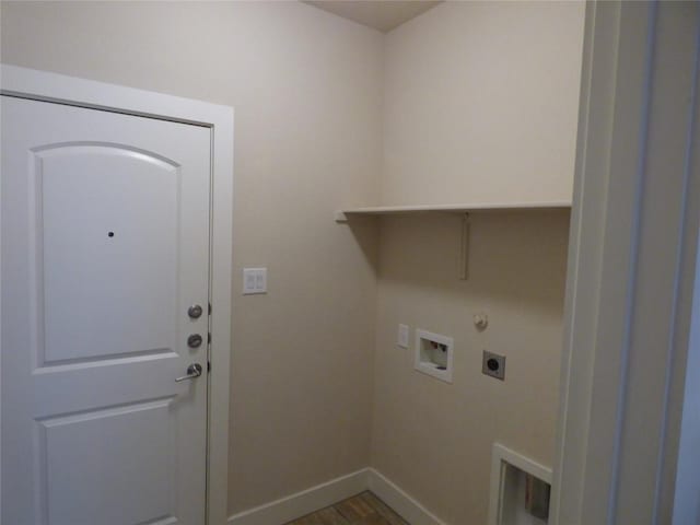 918 Crystal Brook Cv, New Braunfels, TX 78130 - laundry area featuring electric dryer hookup, baseboards, hookup for a washing machine, dark wood finished floors, and gas dryer hookup