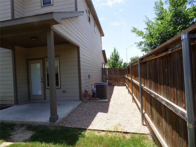 918 Crystal Brook Cv, New Braunfels, TX 78130 - view of side of home featuring central AC, a patio area, and a fenced backyard