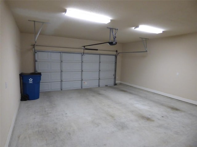 918 Crystal Brook Cv, New Braunfels, TX 78130 - garage featuring baseboards and a garage door opener