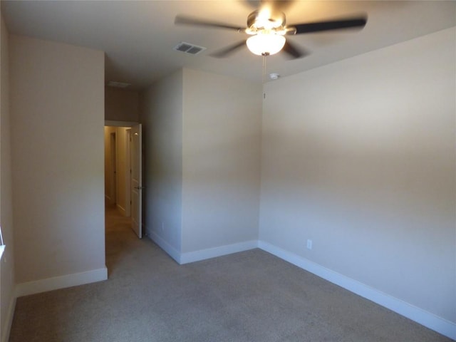 918 Crystal Brook Cv, New Braunfels, TX 78130 - spare room featuring ceiling fan, light colored carpet, and baseboards