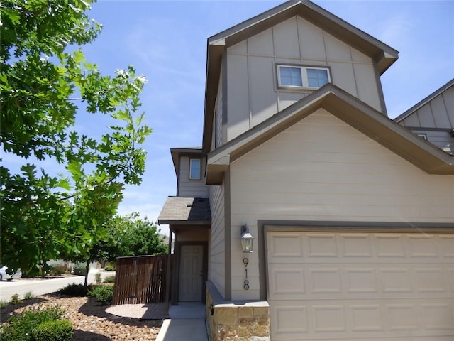 918 Crystal Brook Cv, New Braunfels, TX 78130 - view of front of house featuring a garage and board and batten siding