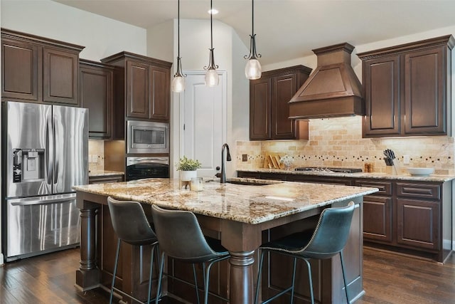 209 Maxwell Way, Austin, TX 78738 - kitchen with stainless steel appliances, custom range hood, a sink, and dark wood-style flooring