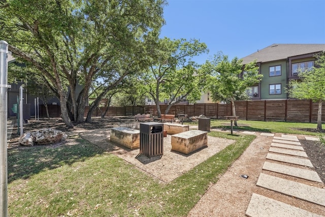 view of yard featuring an outdoor fire pit and a patio