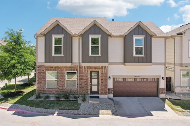 multi unit property with board and batten siding, concrete driveway, a garage, and brick siding