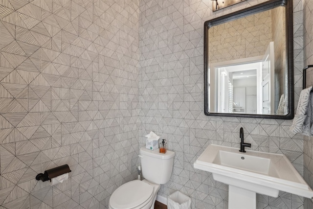bathroom with toilet and a sink