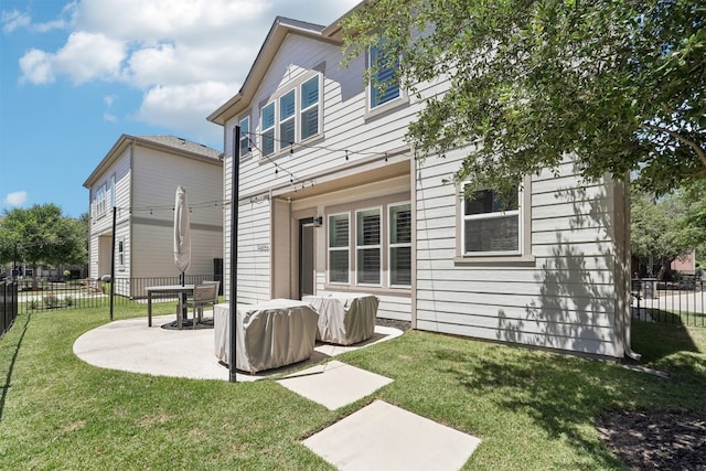 rear view of house featuring a patio