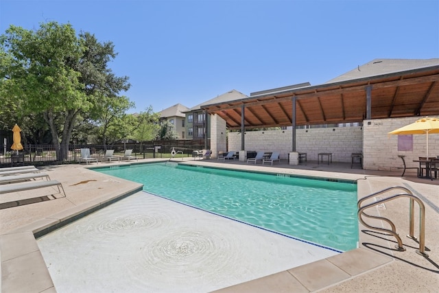 community pool featuring a patio area