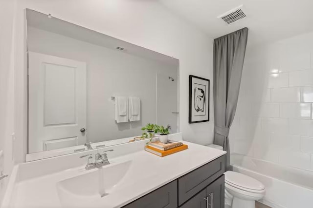 553 Tailwind Dr, Kyle, TX 78640 - bathroom featuring toilet, vanity, and shower / bathtub combination