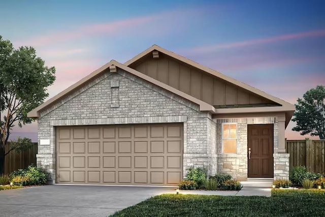 553 Tailwind Dr, Kyle, TX 78640 - ranch-style home featuring stone siding, board and batten siding, concrete driveway, and a garage