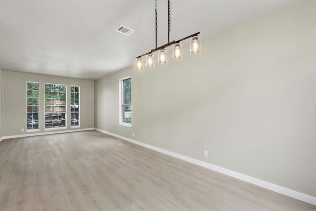7057 Thistle Hill Way, Austin, TX 78754 - spare room with baseboards and light wood-type flooring