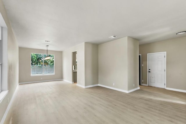 7057 Thistle Hill Way, Austin, TX 78754 - empty room featuring light wood-style flooring and baseboards
