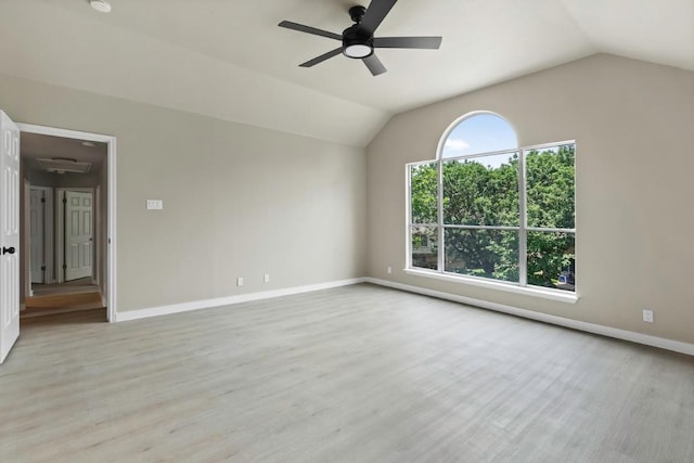 7057 Thistle Hill Way, Austin, TX 78754 - spare room with ceiling fan, vaulted ceiling, wood finished floors, and baseboards