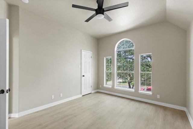7057 Thistle Hill Way, Austin, TX 78754 - empty room with wood finished floors, a ceiling fan, baseboards, and lofted ceiling