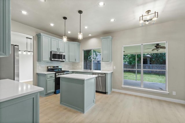 7057 Thistle Hill Way, Austin, TX 78754 - kitchen with appliances with stainless steel finishes, backsplash, light wood-style floors, recessed lighting, and light countertops