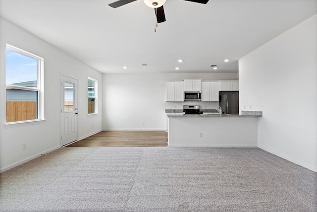 508 Aplite Pass, Maxwell, TX 78656 - kitchen featuring stainless steel appliances, white cabinets, a ceiling fan, recessed lighting, and baseboards