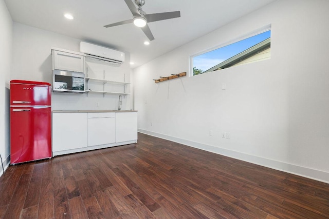 7301 Providence Ave Unit B, Austin, TX 78752 - kitchen featuring refrigerator, a wall mounted air conditioner, open shelves, stainless steel microwave, and white cabinetry