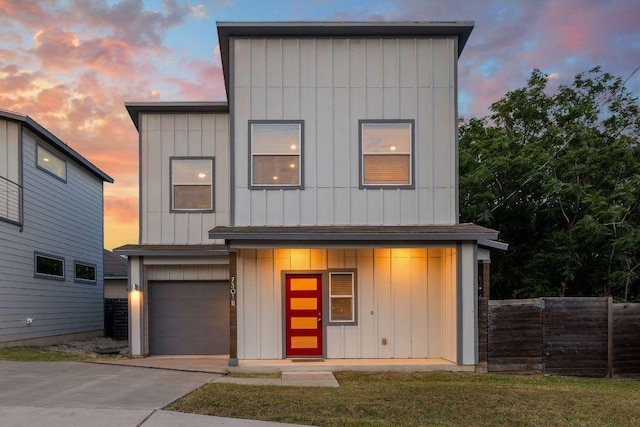7301 Providence Ave Unit B, Austin, TX 78752 - contemporary home with board and batten siding, a garage, and concrete driveway