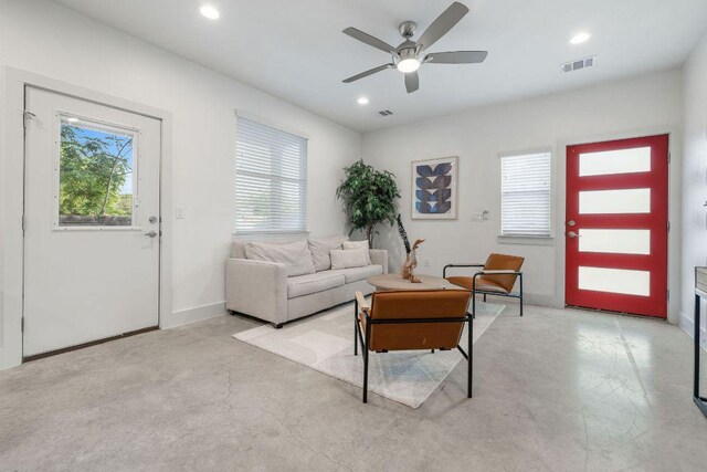 7301 Providence Ave Unit B, Austin, TX 78752 - living room featuring healthy amount of natural light, ceiling fan, concrete floors, and recessed lighting