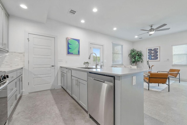 7301 Providence Ave Unit B, Austin, TX 78752 - kitchen with dishwasher, a sink, finished concrete flooring, ceiling fan, and recessed lighting