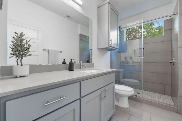 7301 Providence Ave Unit B, Austin, TX 78752 - bathroom featuring vanity, tile patterned flooring, and a shower stall