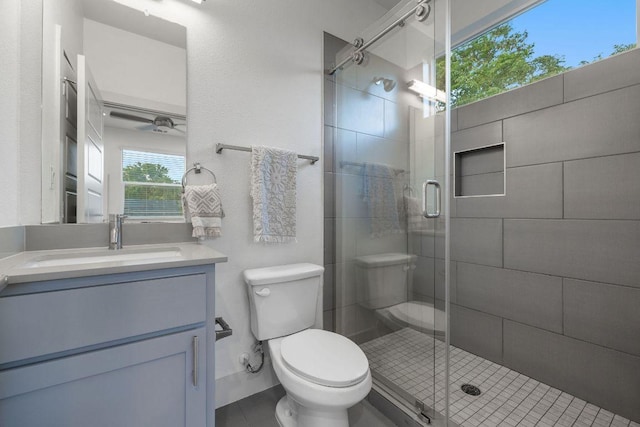 7301 Providence Ave Unit B, Austin, TX 78752 - bathroom featuring vanity, a shower stall, tile patterned flooring, and a ceiling fan