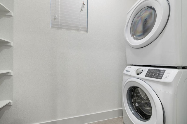 7301 Providence Ave Unit B, Austin, TX 78752 - washroom featuring stacked washer / drying machine and baseboards