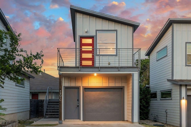 7301 Providence Ave Unit B, Austin, TX 78752 - contemporary house with a balcony, board and batten siding, concrete driveway, and a garage