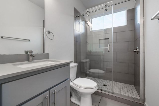 7301 Providence Ave Unit B, Austin, TX 78752 - bathroom with toilet, a stall shower, vanity, and tile patterned floors